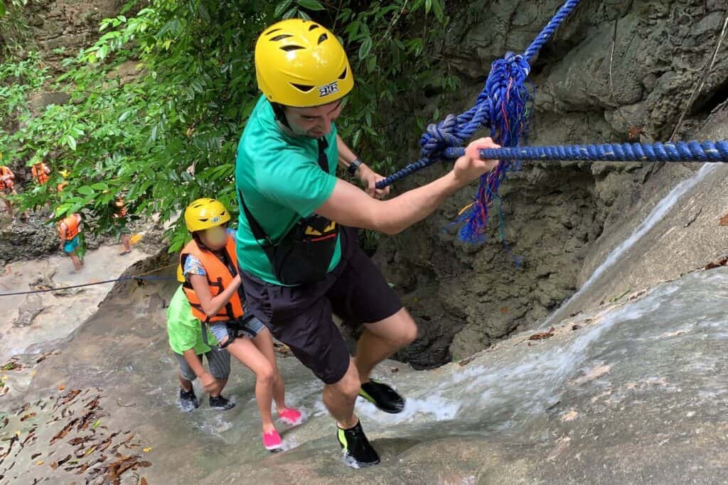 Eric Claggett hiking Kawasan Falls in Cebu, Philippines.