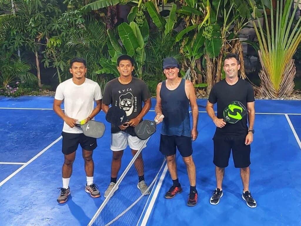 Pickleball in Cebu, Philippines at Beyond Island Resort in Moalboal. Four pickleball players.