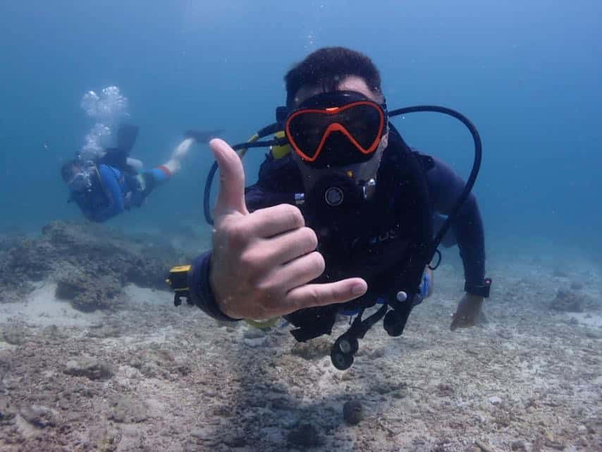 American tourist scuba diving in Moalboal, Cebu, Philippines.