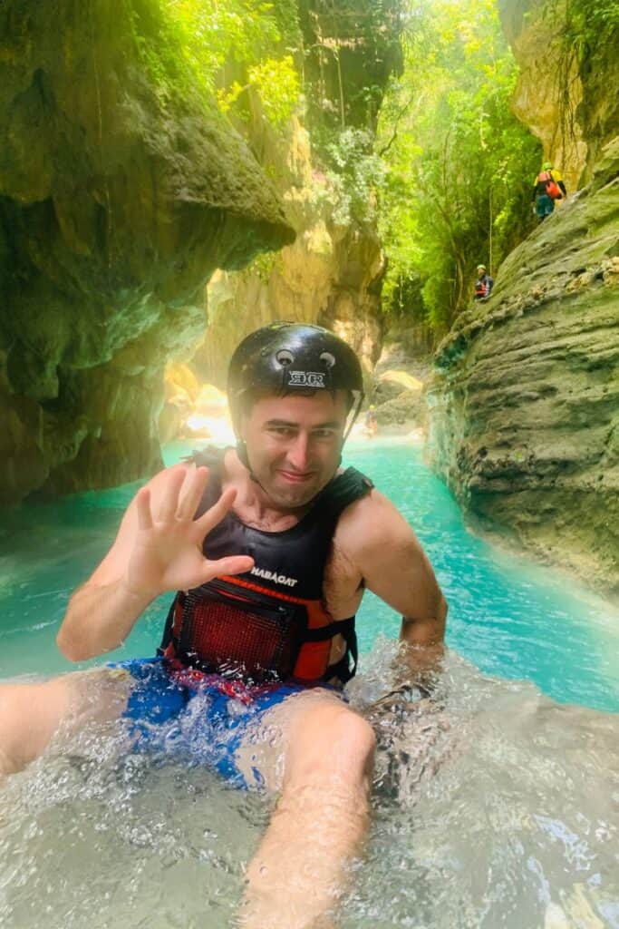 Eric Claggett canyoneering at Kawasan Falls in Cebu, Philippines.