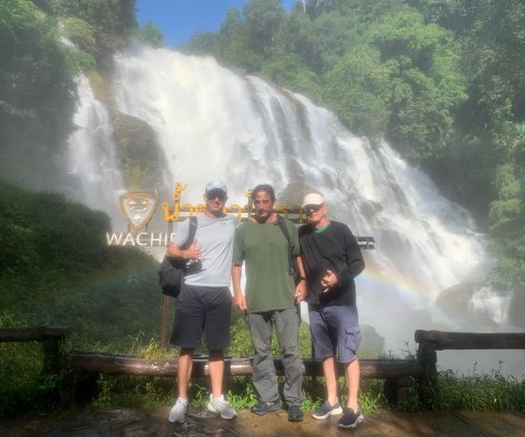 Three American tourists visiting the Doi Inthanon National Park waterfall in Chiang Mai Thailand.