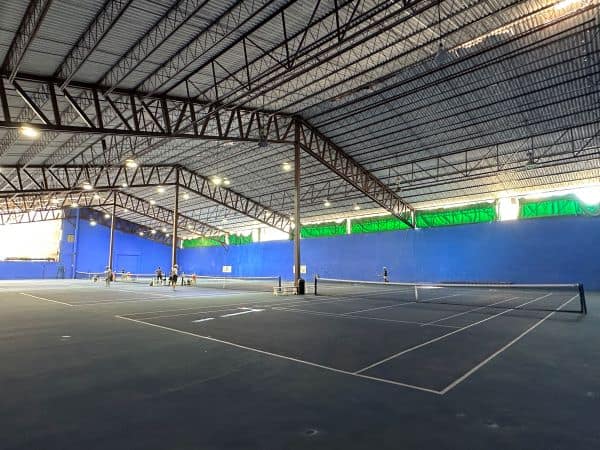 Covered hard tennis courts at Canto del Sol Tennis Club in Puerto Vallarta, Mexico.