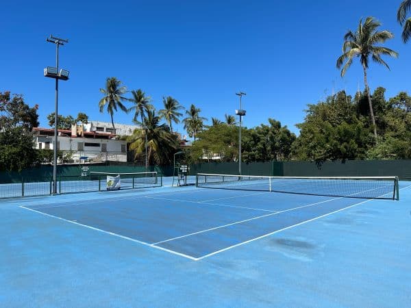 Beautiful blue tennis courts at Narval Tennis Club in Puerto Vallarta, Mexico.