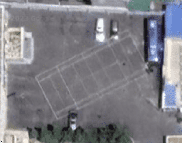 A random tennis court in Pyongyang, North Korea near a high school.