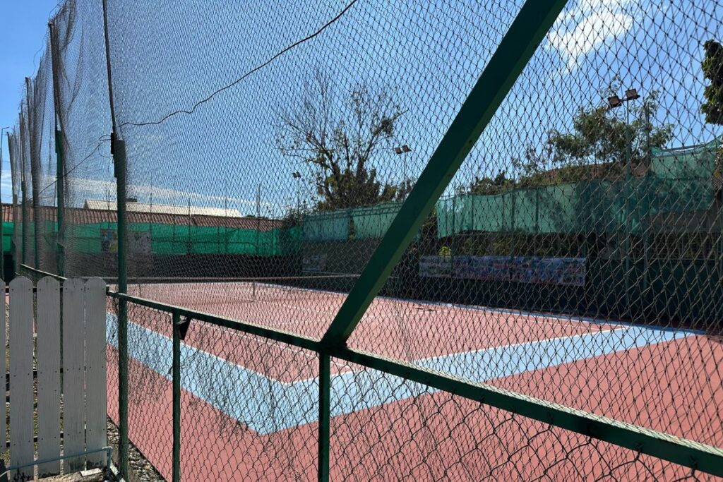 Nongbone Tennis fenced hardcourt in Vientiane, Laos.