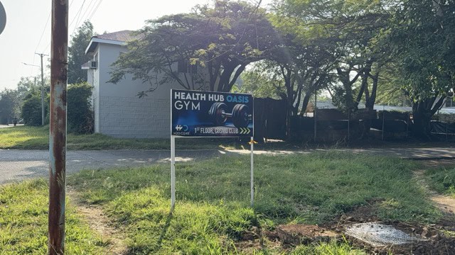 The Cosmo Club sign from the road.
