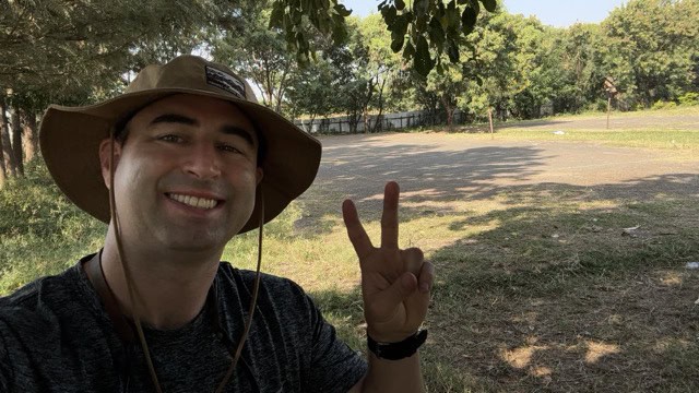 American tennis player takes selfie at Kisumu Day Tennis Court, located on Kisumu Day High School.