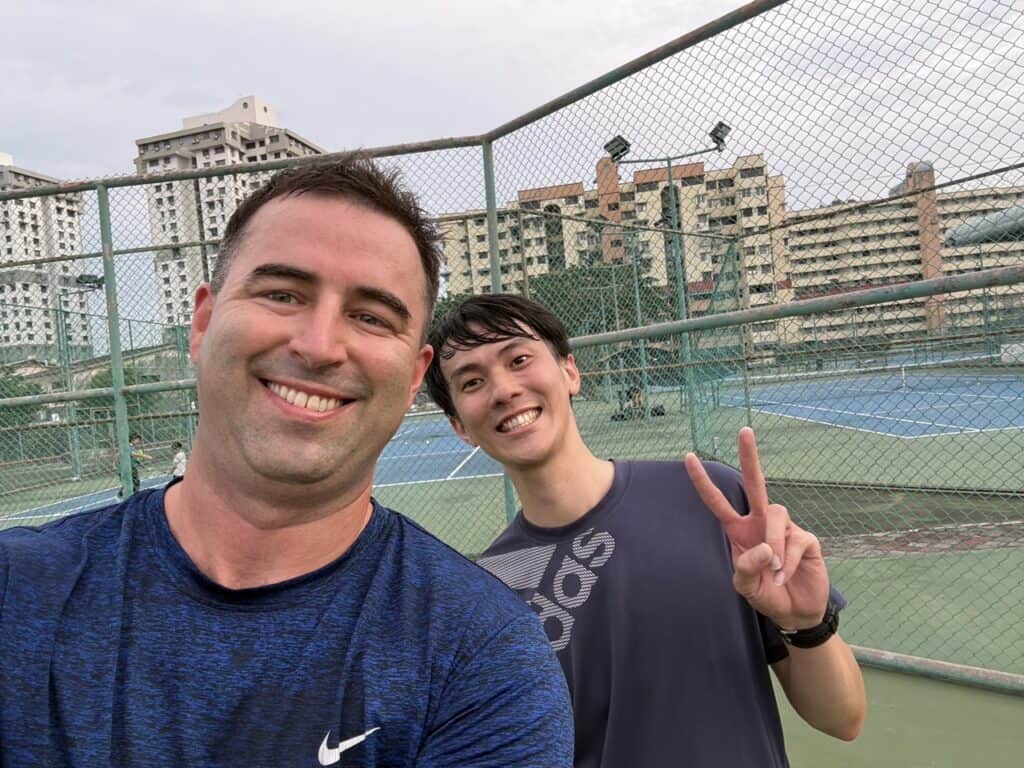 USM tennis courts in Georgetown, Penang, Malaysia, selfie with two tennis players.